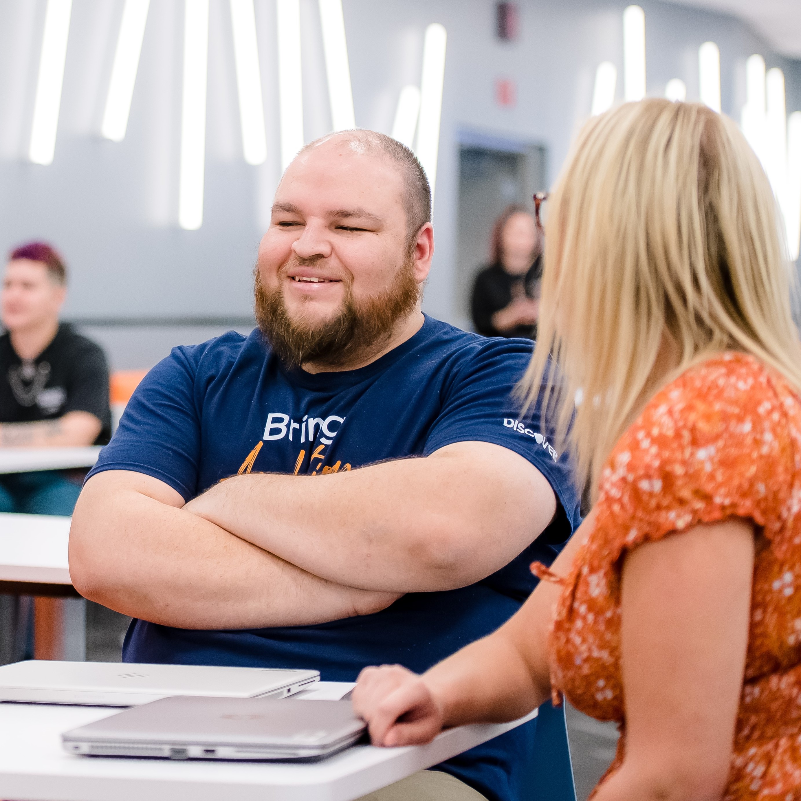 Two employees engaged in conversation